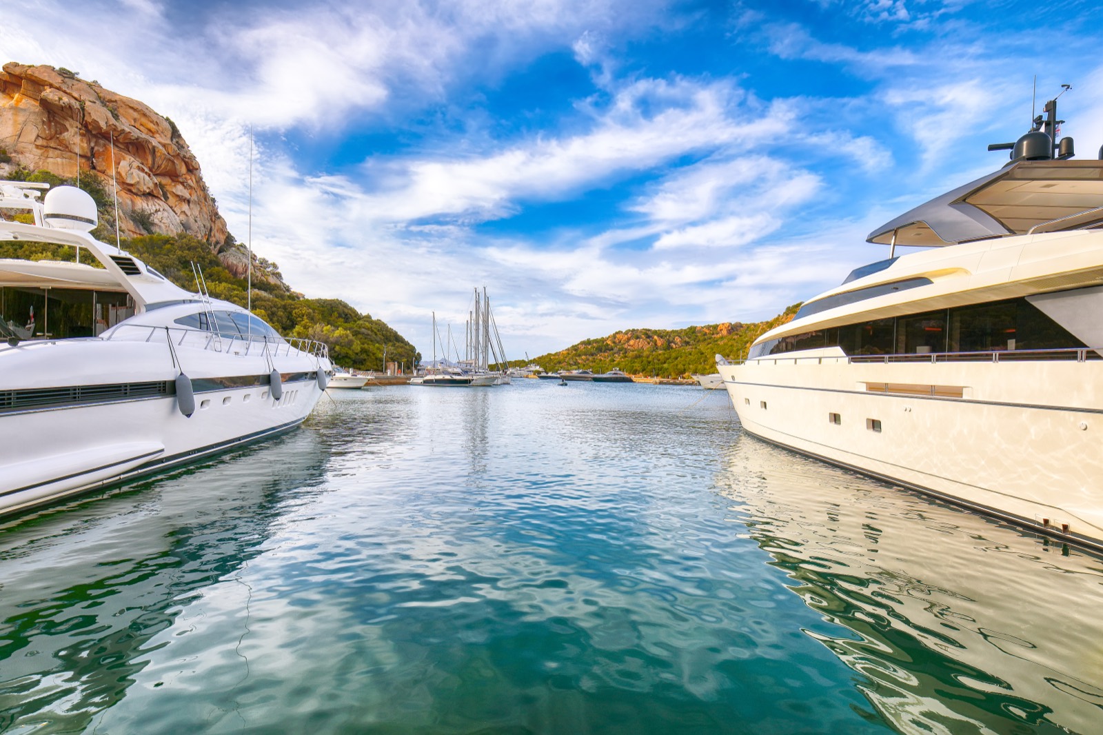 View of a Mediterranean port and bay with luxury boats